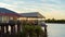 People Dining At Waterfront Restaurant At Sunset