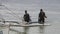 People divers on boat on background of green Pacific coast in Philippines.