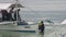 People divers on boat on background of green Pacific coast in Philippines.