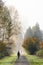 People and dog exercise on  Snoqualmie Valley Trail on a misty and frosty morning