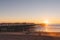 People doing activities at the beach near the pier with beautiful sunset. Pacific Beach in San Diego, California