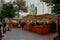 The people doing shopping at an open market in a Spanish residential district in Barcelona, Spain