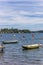 People doing standup paddleboarding in the lake of Plon