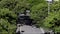 People doing walking exercise in the city of Belo Horizonte. Cyclists. Trees in the wind