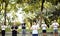 People doing yoga at the park