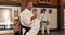 People in dojo with sensei for aikido training, fitness and challenge with gym, exercise and coaching. Teaching