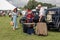 People dressed up in period costumes for a picnic with vintage cars, 1940s