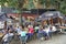 People drink, eat and talk on the terrace of a cafe