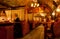 People drink inside the old bar with wooden tables