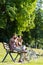 People drinking coffee in park