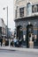 People drinking outside The Old Blue Last pub in Shoreditch, London, UK