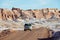 People drive car in Valle de la Luna in San Pedro de Atacama, Chile.