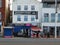 People eating outside the beachcomber restaurant and fish and chips takeaway on the promenade in blackpool