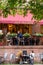 People eating outside at Cafe Brasserie as bars and restaurants