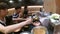 People eating sushi from sushi conveyor belt buffet at japanese restaurant