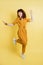 People, emotions, fun and joy. Full length portrait of crazy excited joyful pretty young lady in yellow overalls and