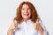 People, emotions and lifestyle concept. Close-up of excited and happy redhead woman full of positive emotions, showing