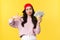 People emotions, lifestyle leisure and beauty concept. Cool and sassy asian girl in red cap, showing swag gesture and