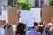 People with empty posters stand at a protest demonstration in Belarus