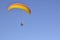 People engage in active sports, paragliding, paraglider hovering on blue sky background