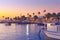 People enjoy a beautiful evening on the upper deck of small boat in the heart of resort town Side