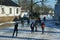 People enjoy ice skating on frozen river in Monnickendam