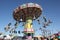 People enjoy spinning carnival ride