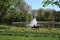 People enjoy spring at the pond with fountain in the Beatrixpark in Amsterdam