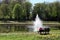 People enjoy spring at the pond with fountain in the Beatrixpark in Amsterdam