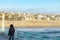 People enjoy the sunset at scenic beach and pier at Manhattan Beach near Los Angeles