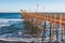 People Enjoy View From Oceanside Fishing Pier