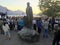 People enjoying an evening street performance on the Main Town Pier in beautiful Queenstown.