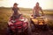 People enjoying extreme riding.Young couple enjoying a quad  vehicle