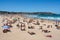 People enjoying hot sunny summer day on Bondi beach in Sydney NSW Australia