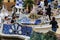 People enjoying mosaic tile benches in Parc Guell