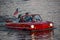 People enjoying ride in red amphibious car at Lake Buena Vista area 1