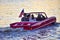 People enjoying ride in red amphibious car at Lake Buena Vista area 4