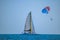 People enjoying of sailboat and parasail  on colorful sunset background in Gulf Coast Beaches 1