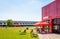 People enjoying a snack-bar on a sunny day in the Parc de la Villette in Paris, France