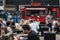 People enjoying street food in Ely`s Yard, London, UK.