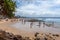 People enjoying the summertime on Rainbow Bay beach.