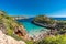 People enjoying sun at Es calo des Moro beach Clasified as one of the best beaches in the world.