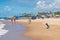 People enjoying a sunny day at Itapua beach