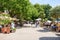 People enjoying a sunny summer day in a pedestrian area on the east bank of River Weiser in Bremen, Germany