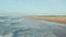 People Enjoying Time at Beach in California in beautiful Afternoon light, Aerial high angle circling slow