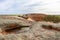 People enjoying the views at Pildappa rock, wave rock in Australia, waterholes on top of the rock. Wide angle picture from above.