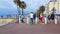 People enjoying walk on Promenade des Anglais, tourism in Nice, time-lapse