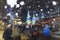 People enjoying Whistler village at night with snow falling