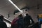 People on the escalator under the directional sign in Stephansplatz station in Vienna, Austria