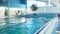 people exercising in the indoor swimming pool. sport in the water.